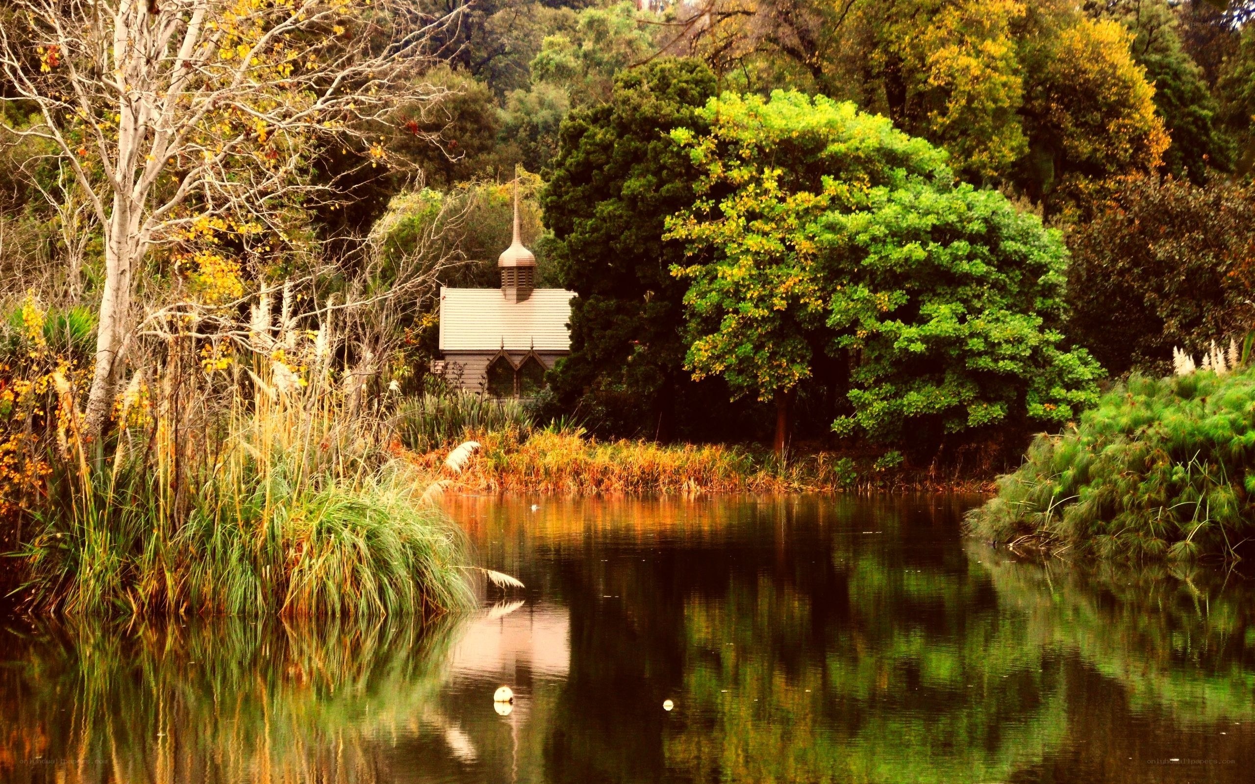 Chapel by the lake in autumn