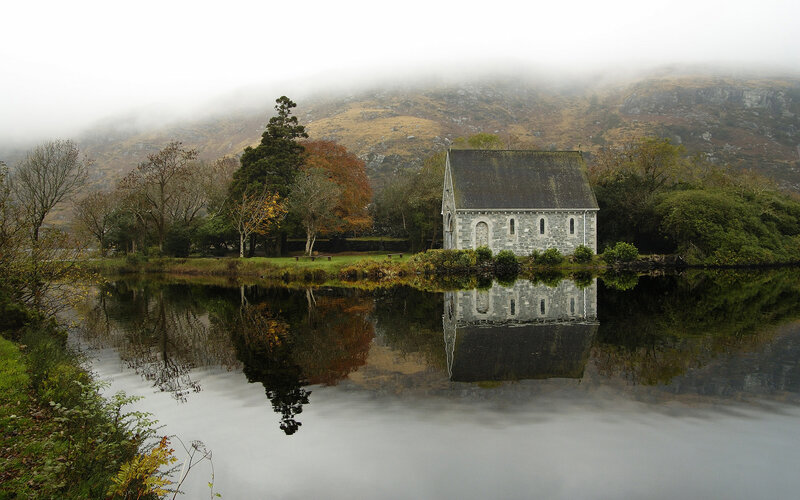 Chapel by the lake in fog