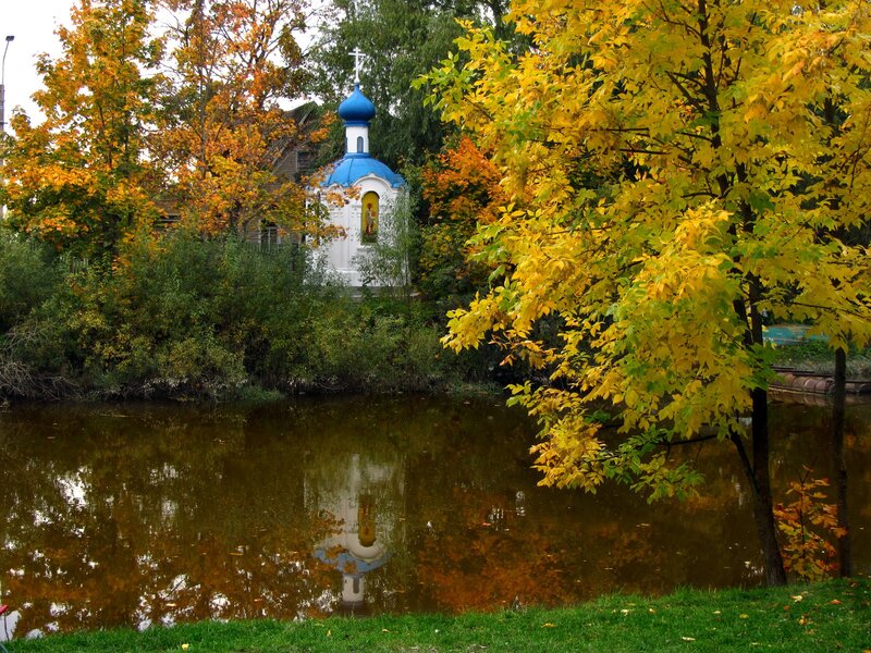 Chapel by the river in autumn