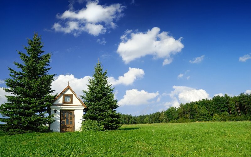 Chapel in a green field
