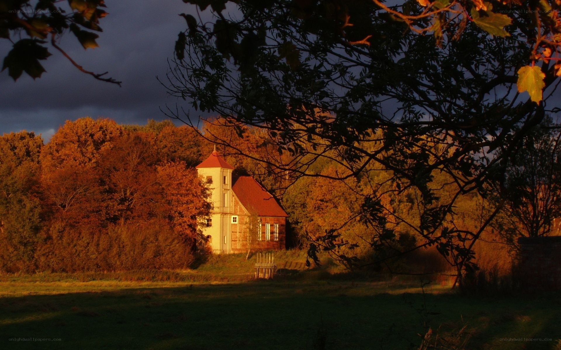 Chapel in autumn landscape