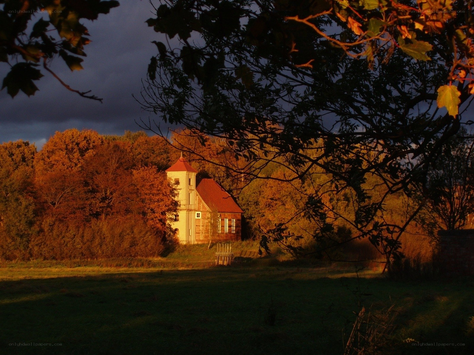 Chapel in autumn landscape