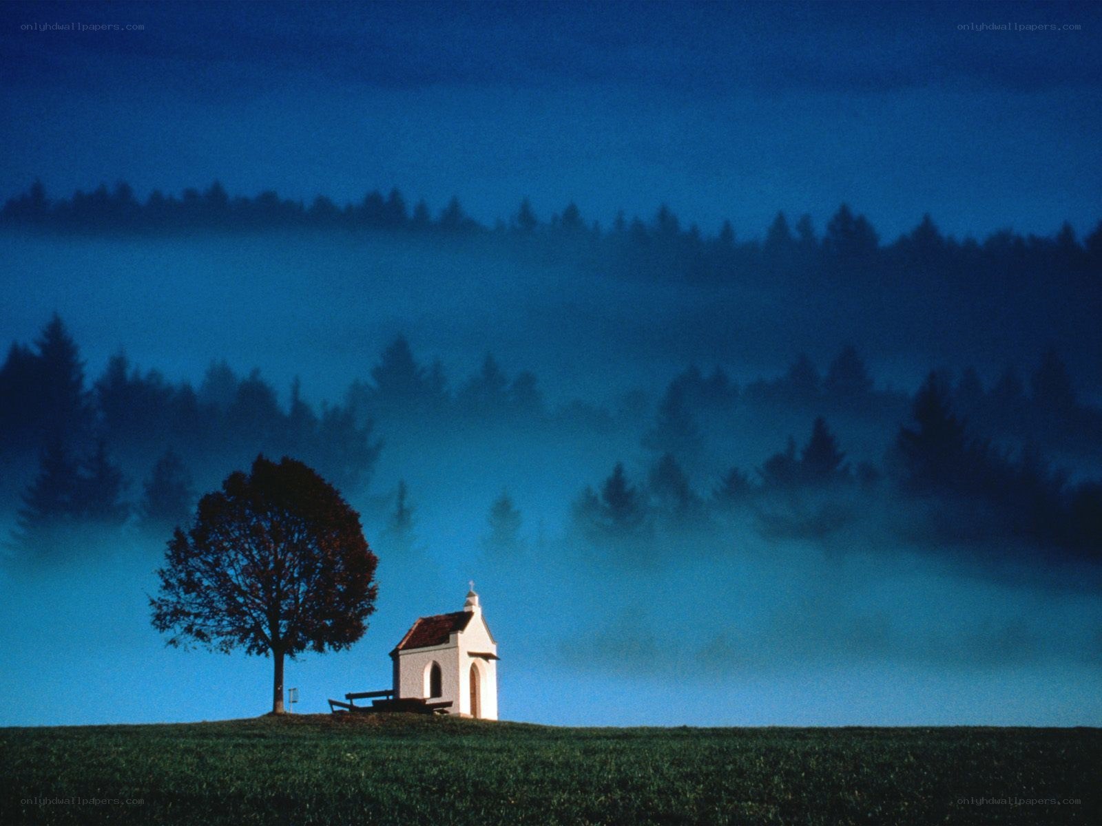 Chapel in misty landscape