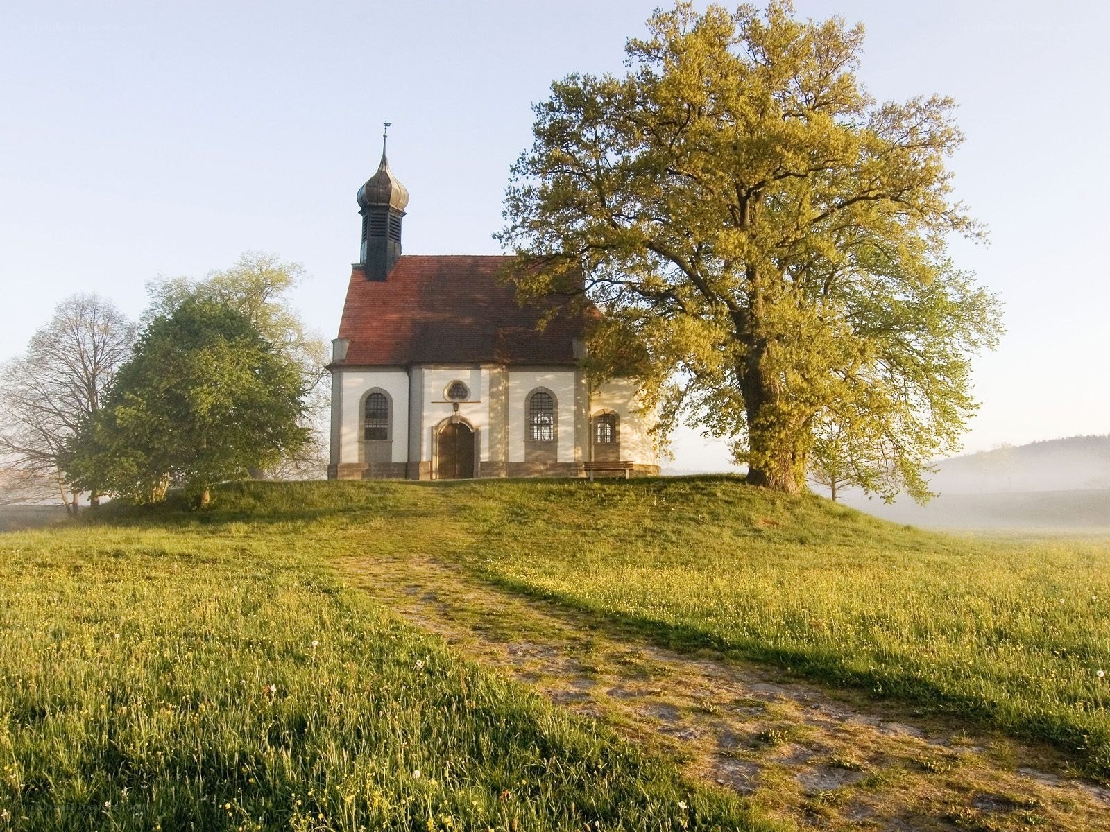 Chapel on a hill at sunrise