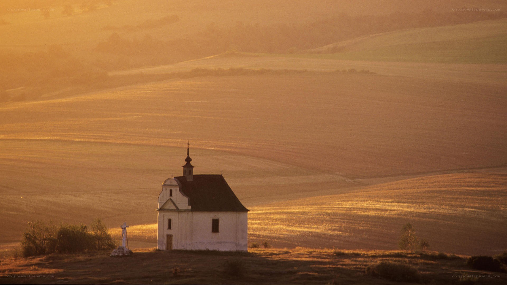 Chapel on a hill at sunset