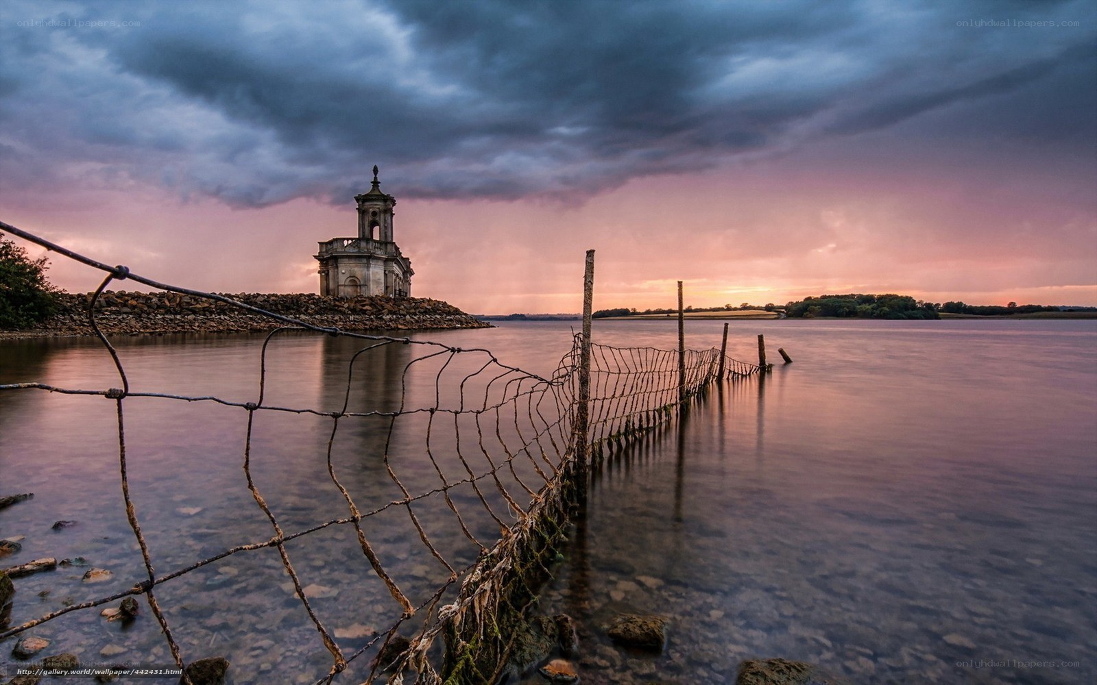 Chapel on a lake at sunset