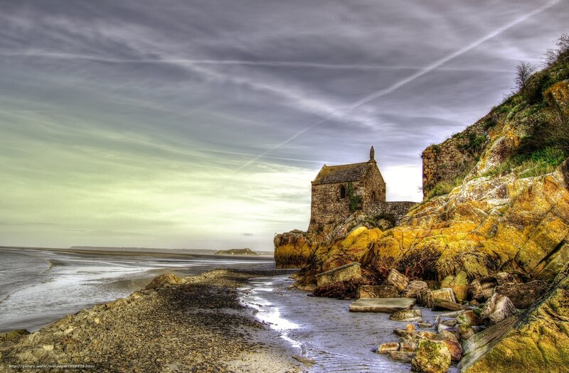 Chapel on rocky coast at low tide