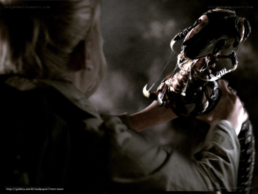 character holding alien creature