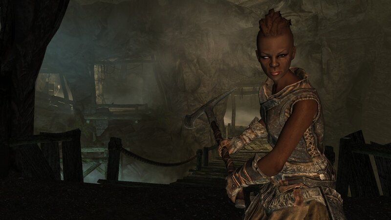 Character in a cave holding an axe