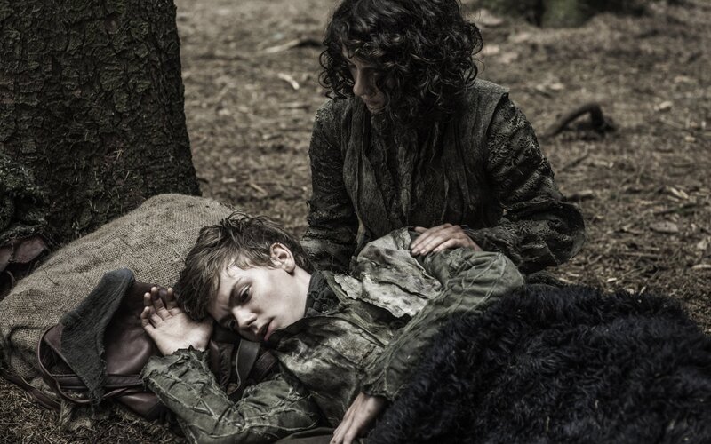 Character in forest with injured companion