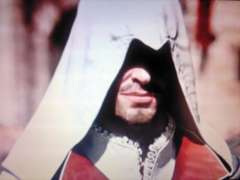 character in hooded cloak