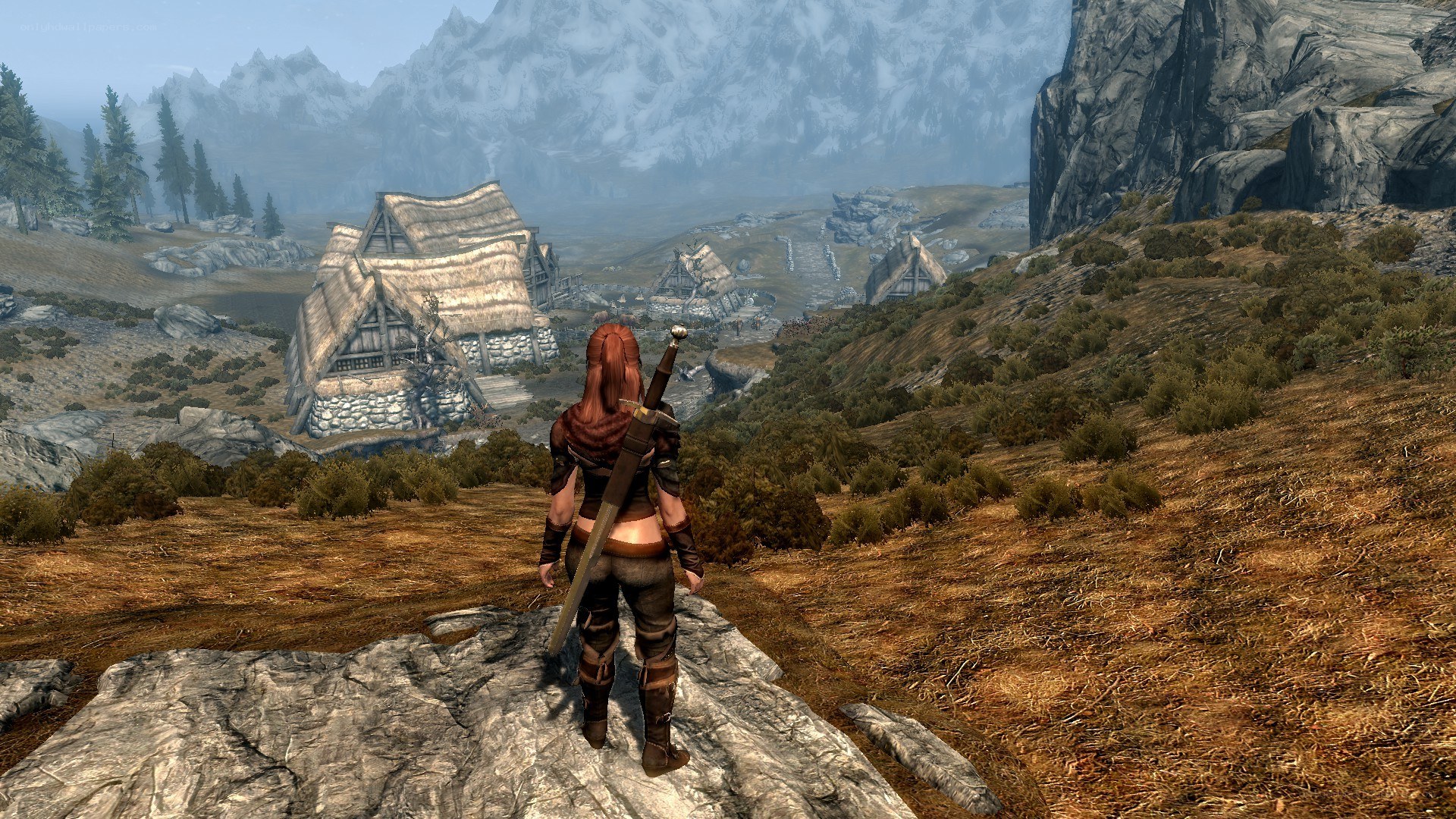 Character overlooking a mountain village