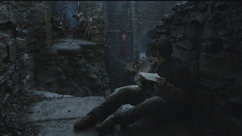 Character reading letter in castle