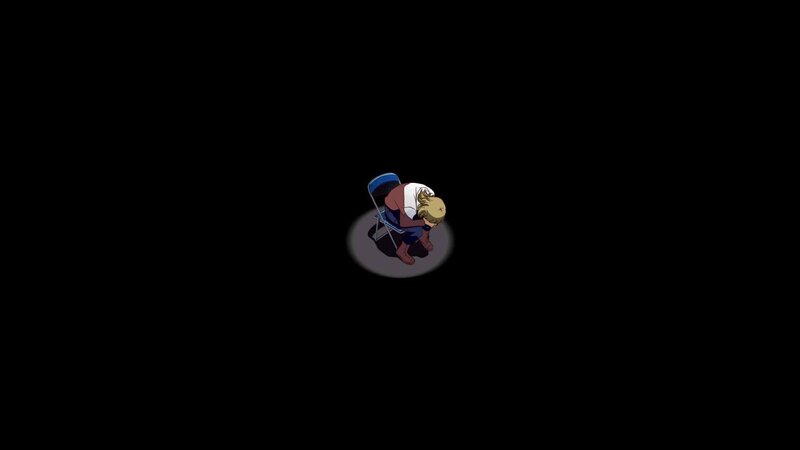 character sitting in spotlight