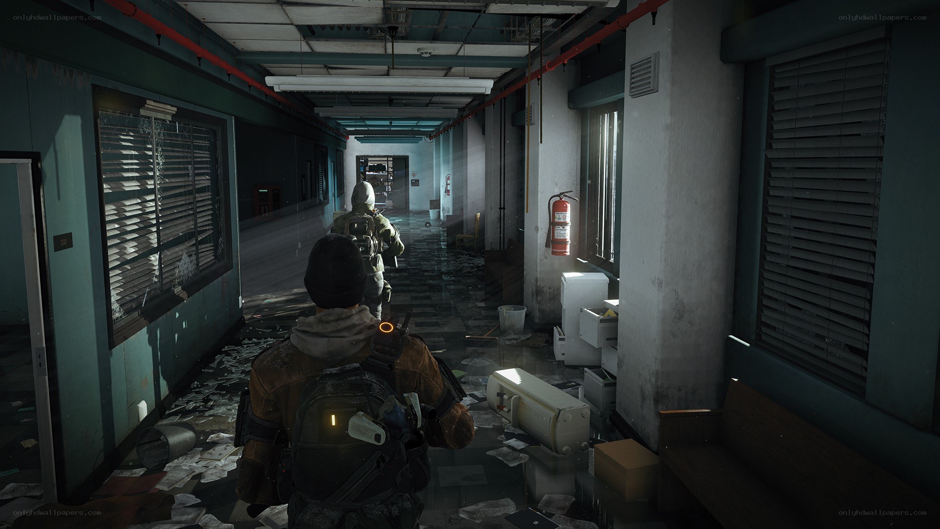 Characters in a dimly lit corridor