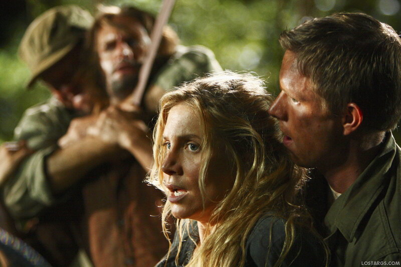 Characters in a tense forest scene