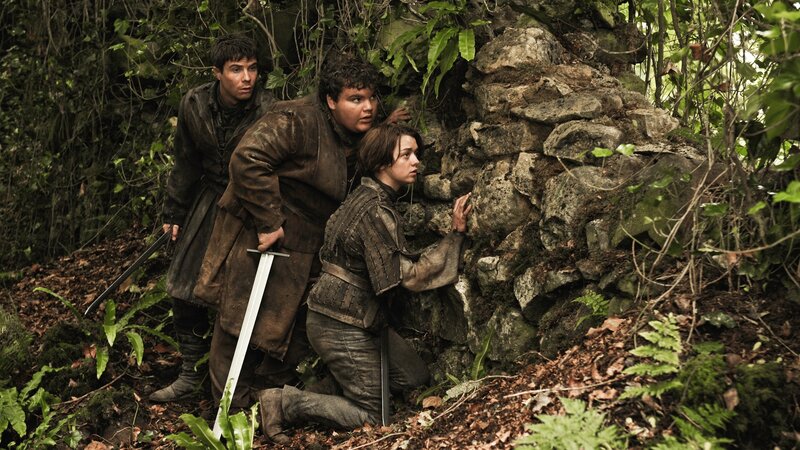 Characters in forest hide from danger