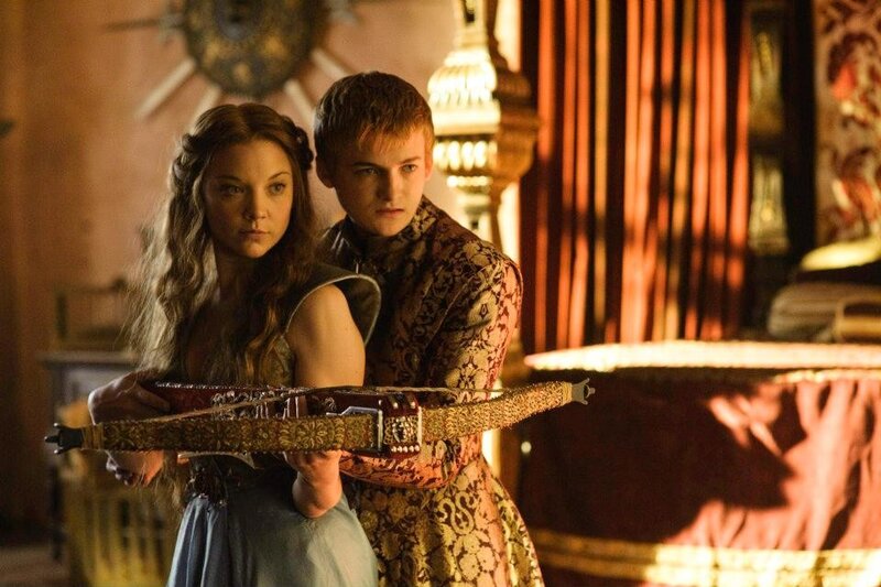 Characters with crossbow in ornate room