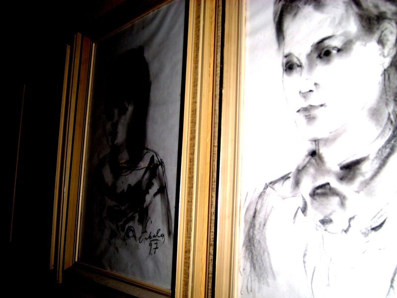 Charcoal portraits in frames