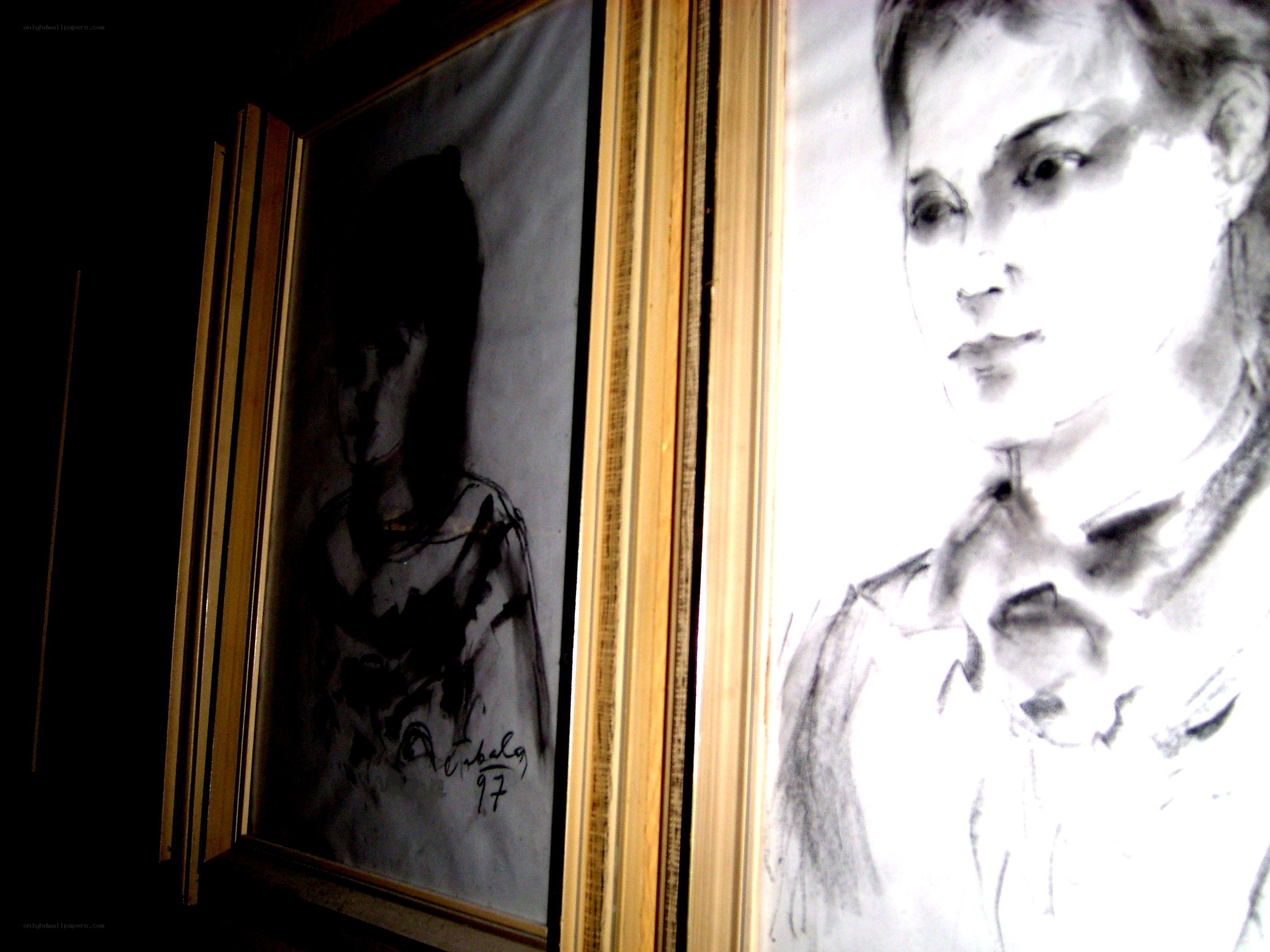 Charcoal portraits in frames