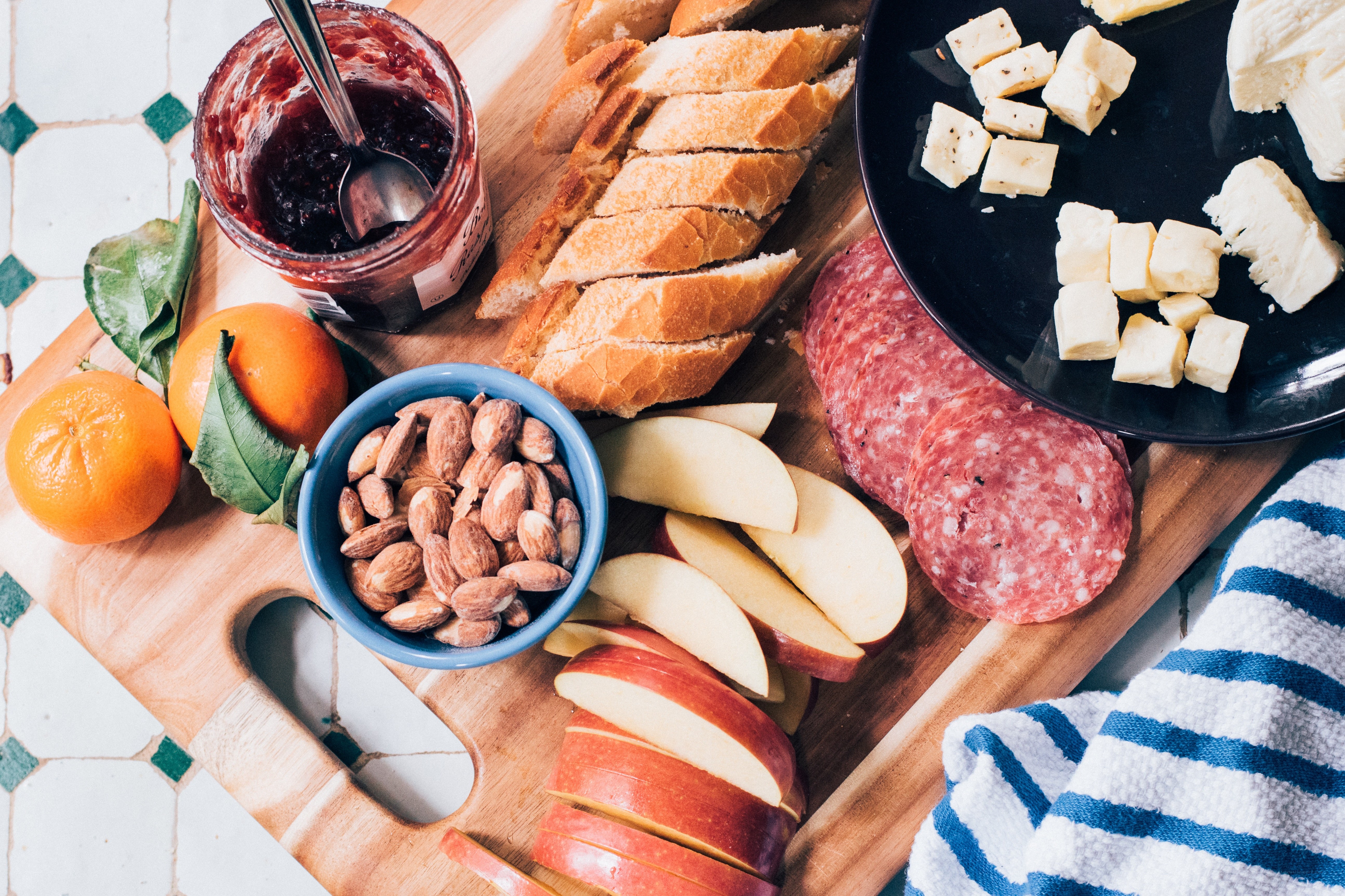 charcuterie board with fruit and nuts