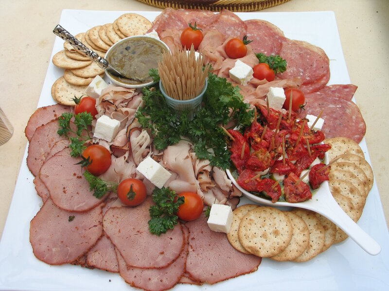 Charcuterie board with meats and crackers