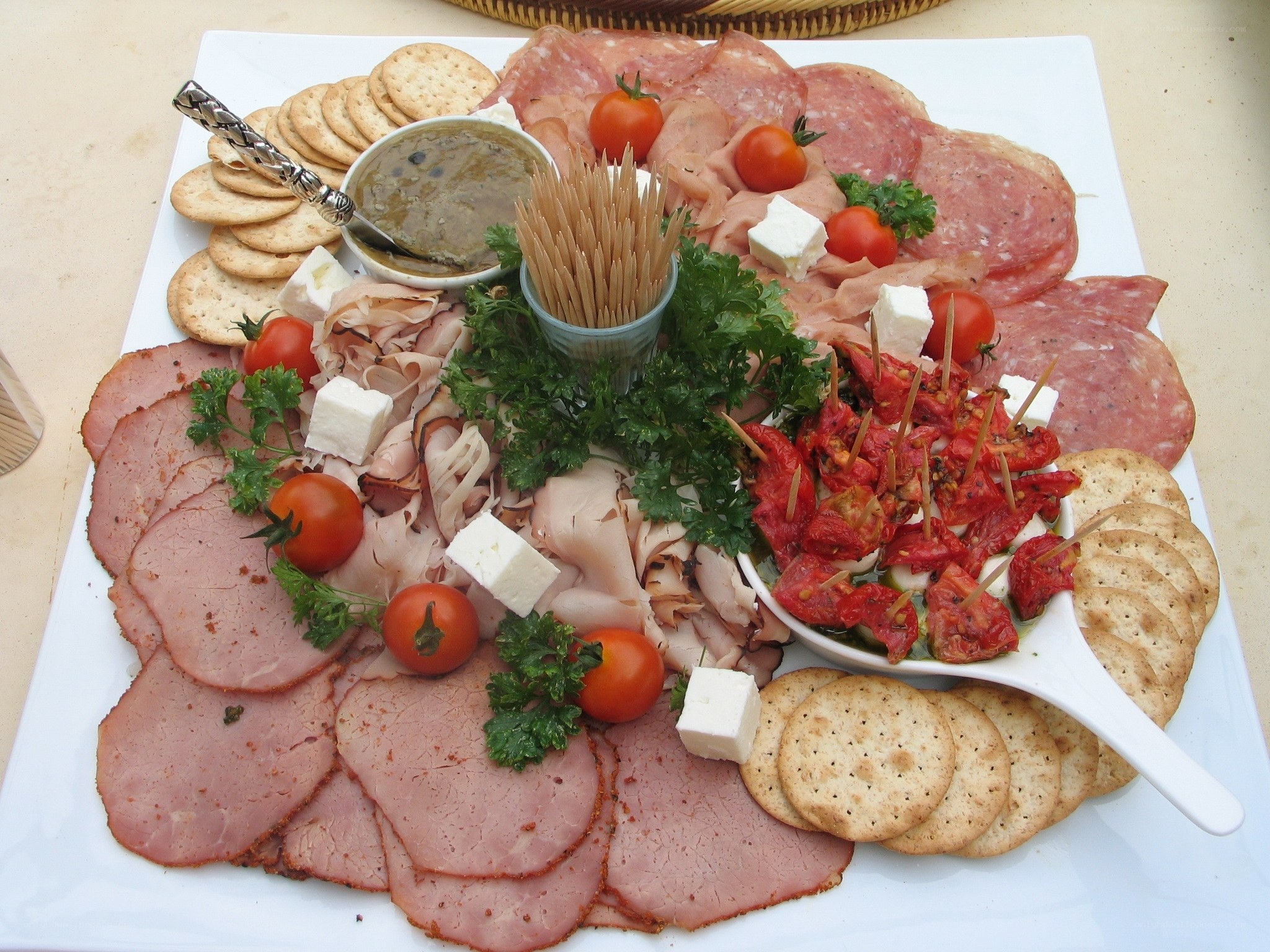 Charcuterie board with meats and crackers