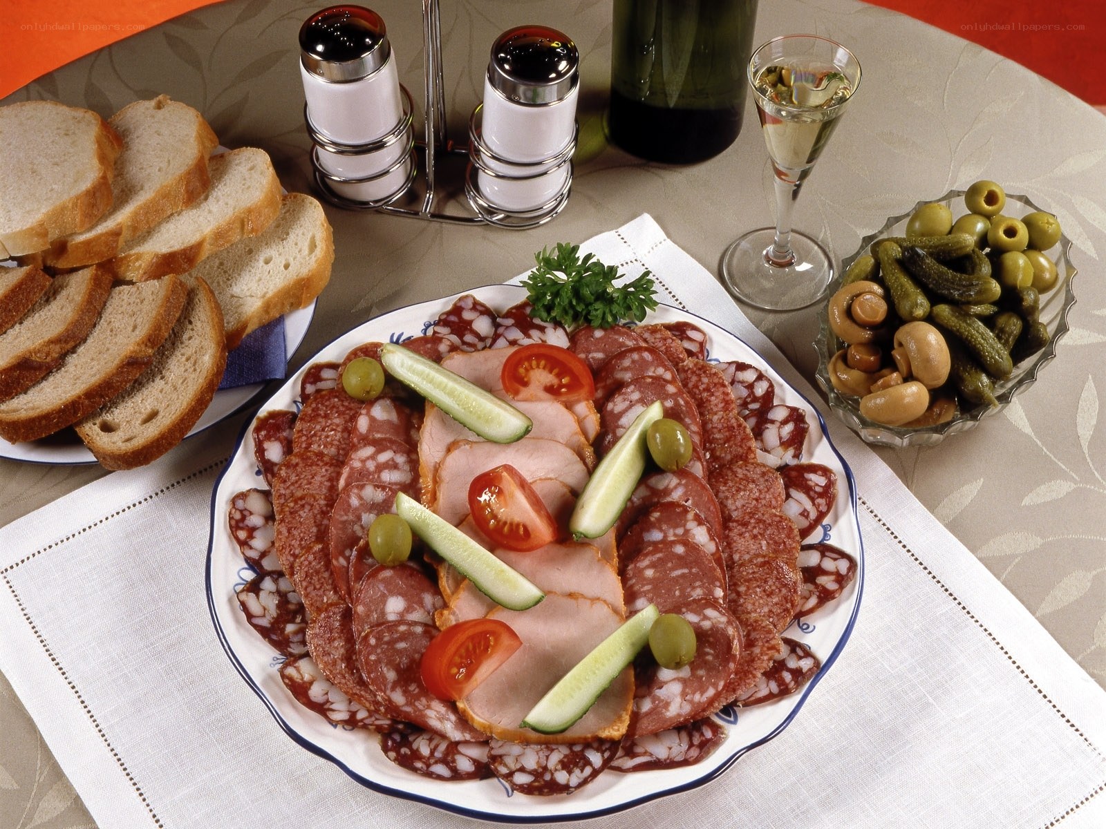 Charcuterie platter with bread and wine