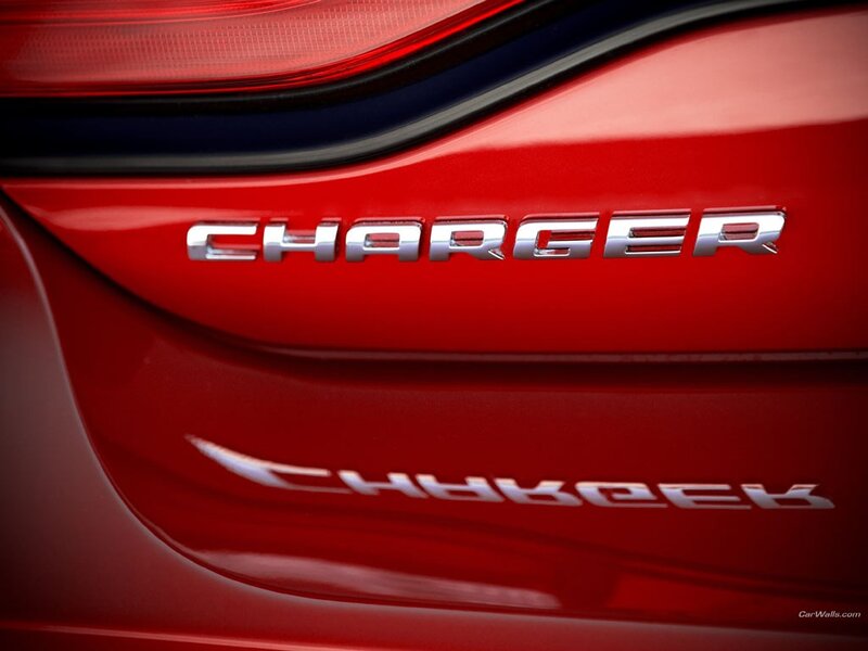 Charger badge on red car