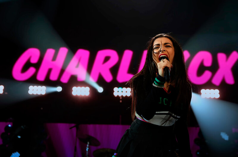 Charli XCX performing on stage