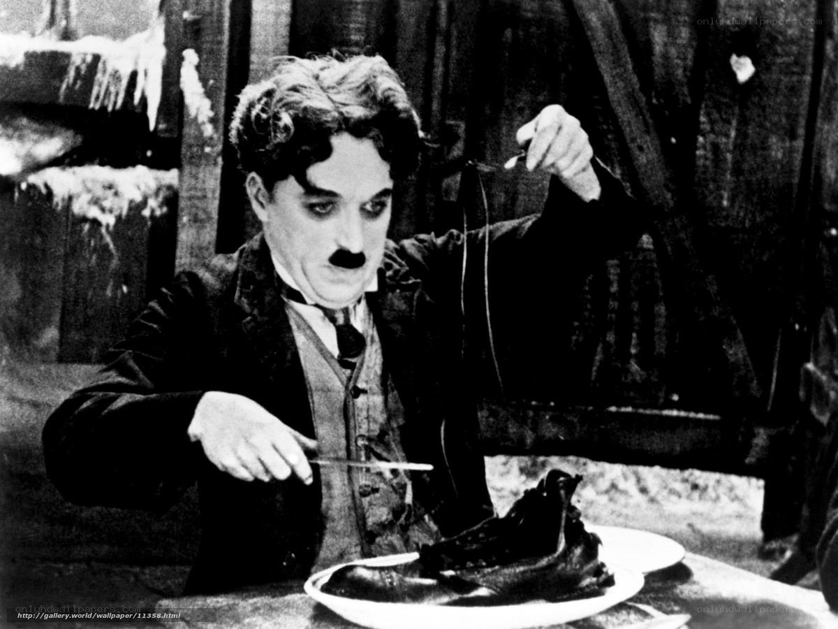 Charlie Chaplin eating shoe