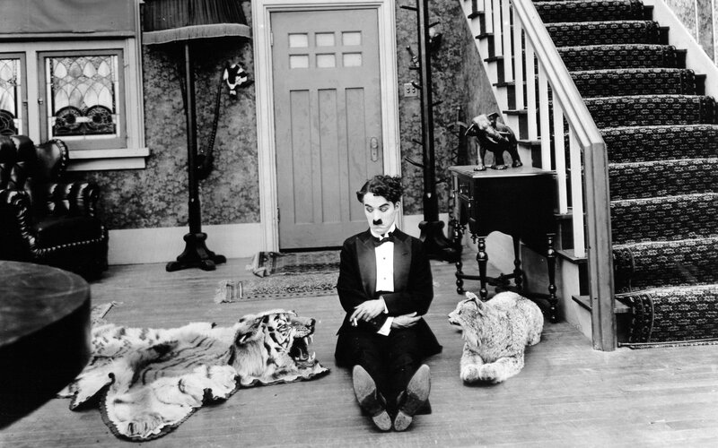 Charlie Chaplin in a living room