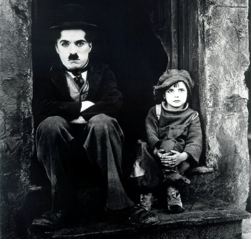 Charlie Chaplin with a child