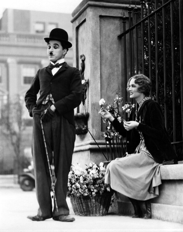 Charlie Chaplin with woman on steps