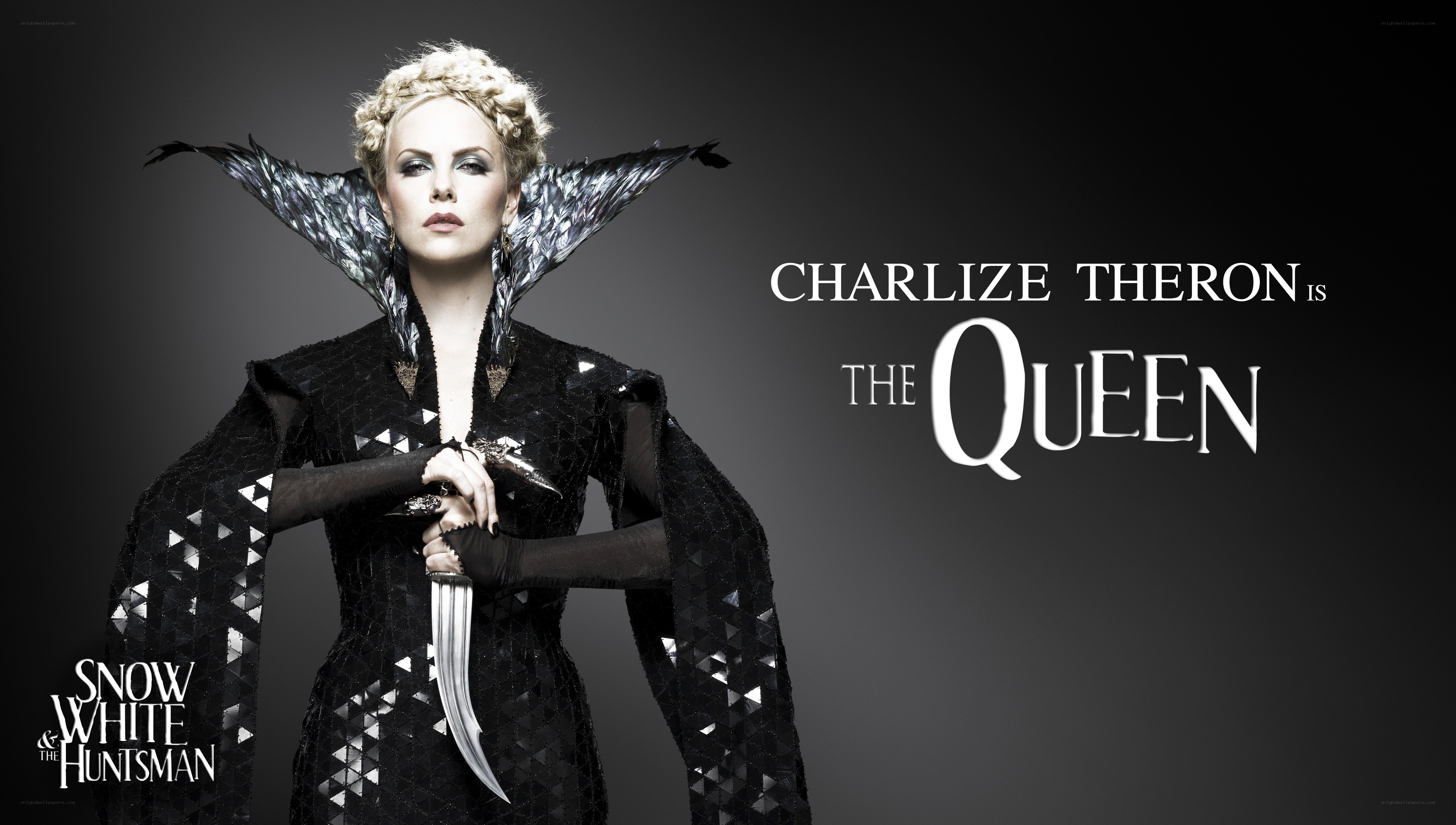 Charlize Theron as the Queen