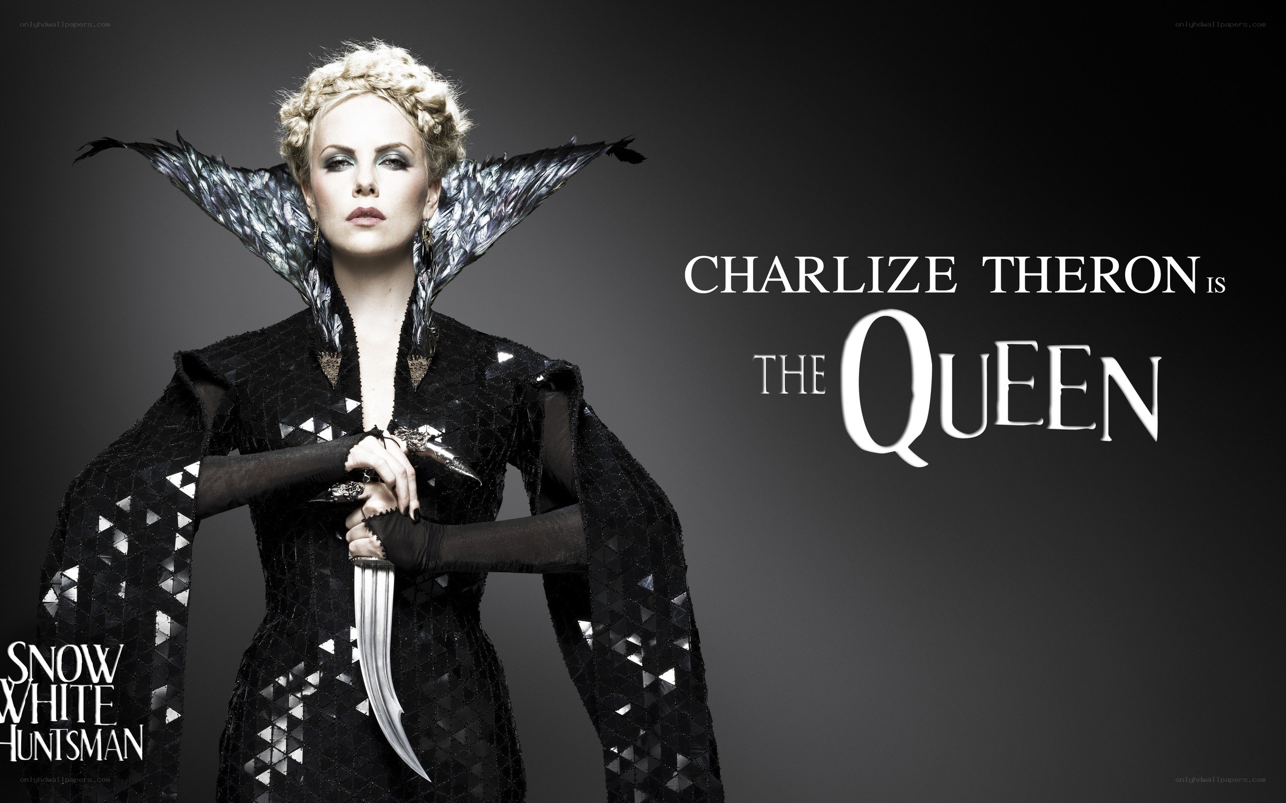 Charlize Theron as the Queen