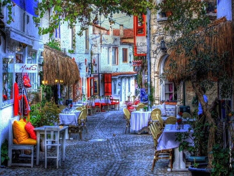 Charming cobblestone alley with outdoor cafes