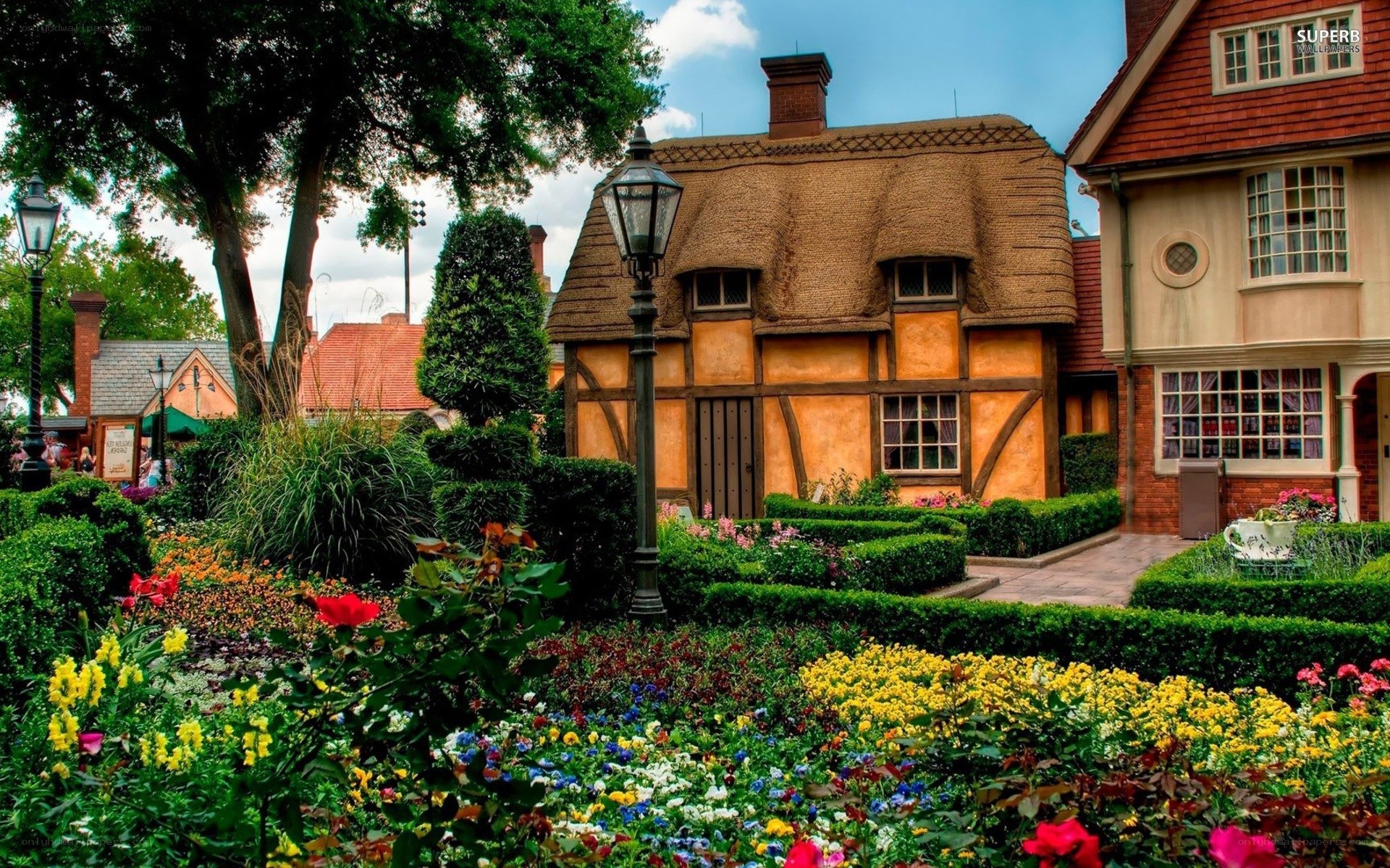 Charming cottage in a flower garden