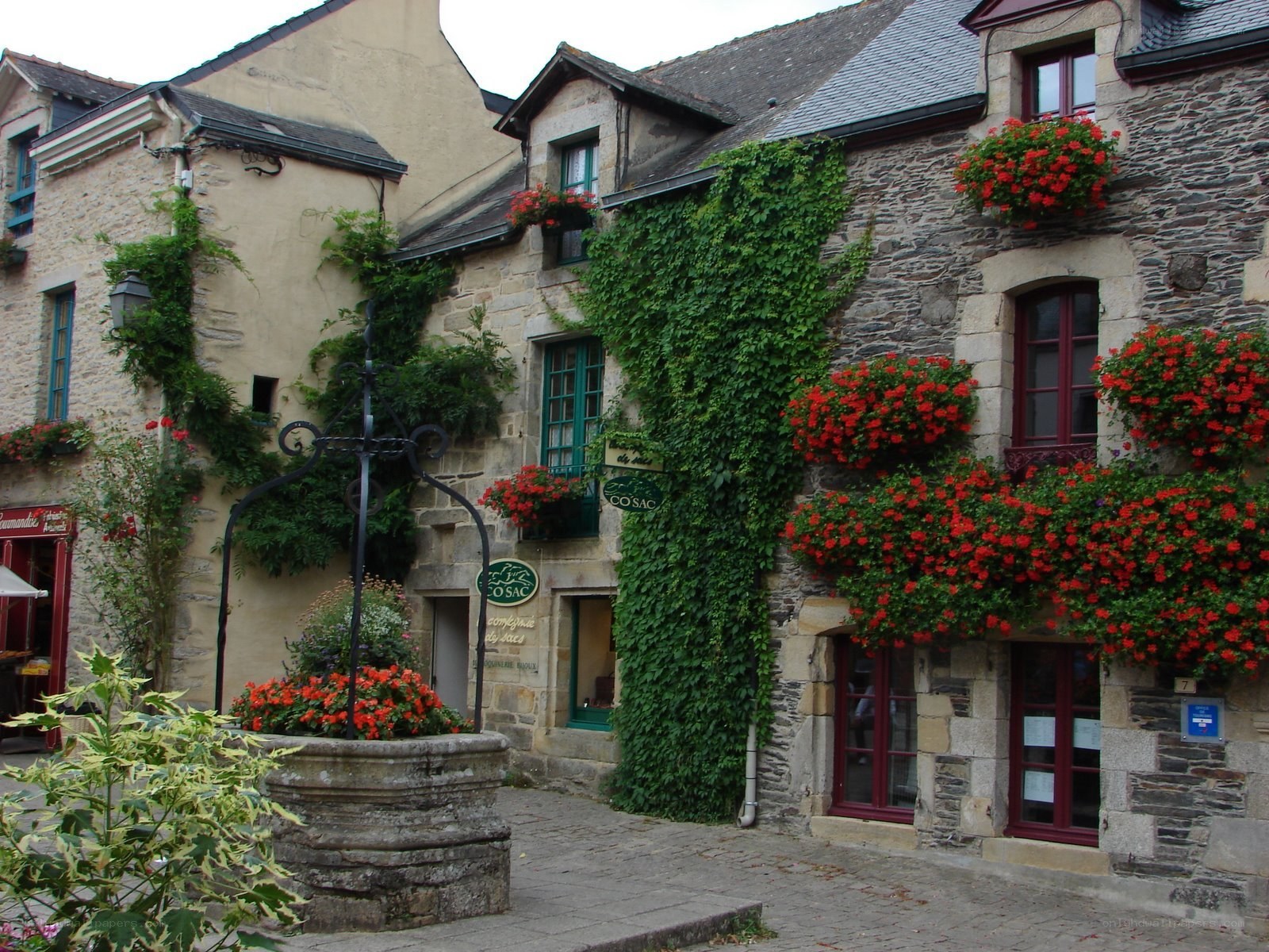 Charming stone village with flower baskets