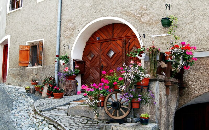 Charming village entrance with flowers