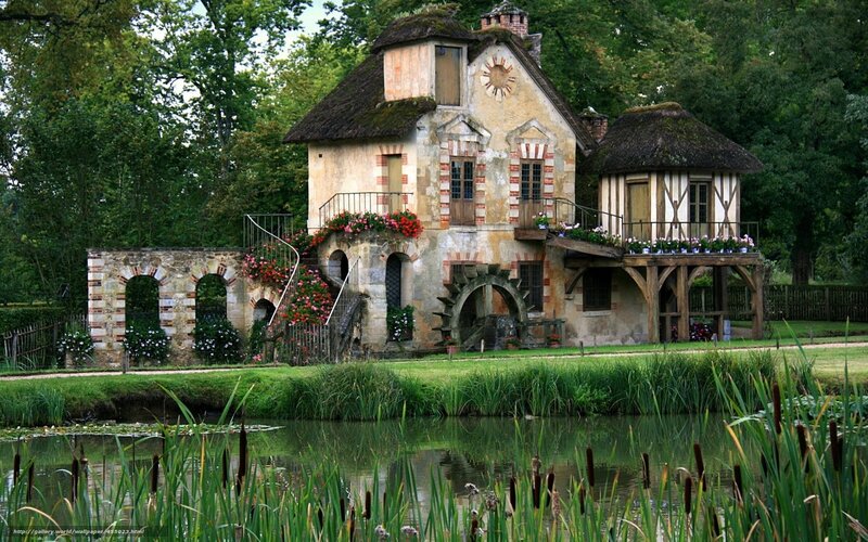Charming watermill by a pond