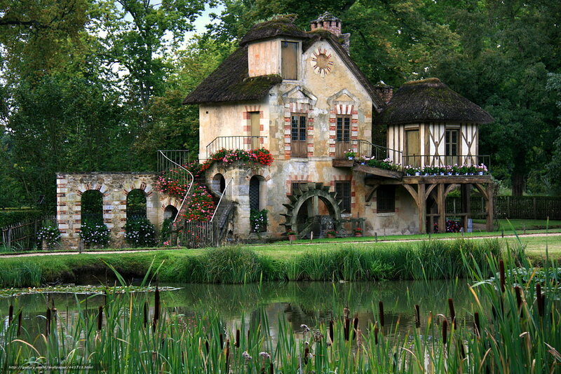 Charming watermill in a lush garden