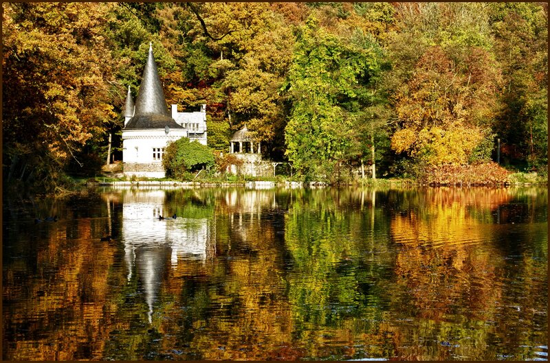 Chateau by a lake in autumn