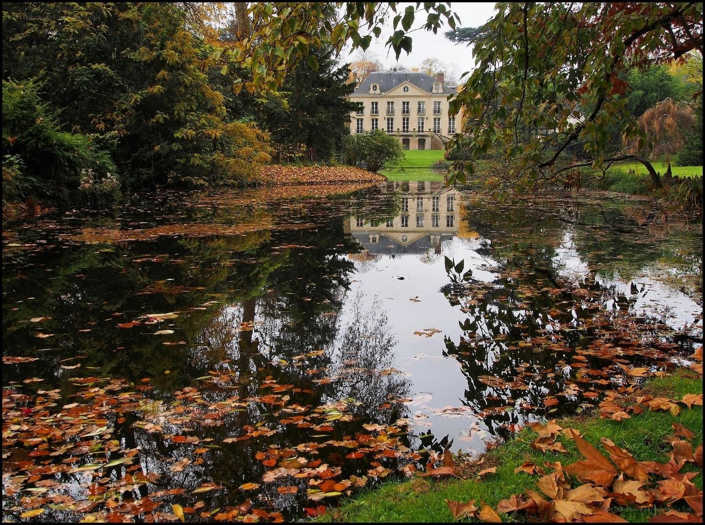 Chateau reflected in autumn pond