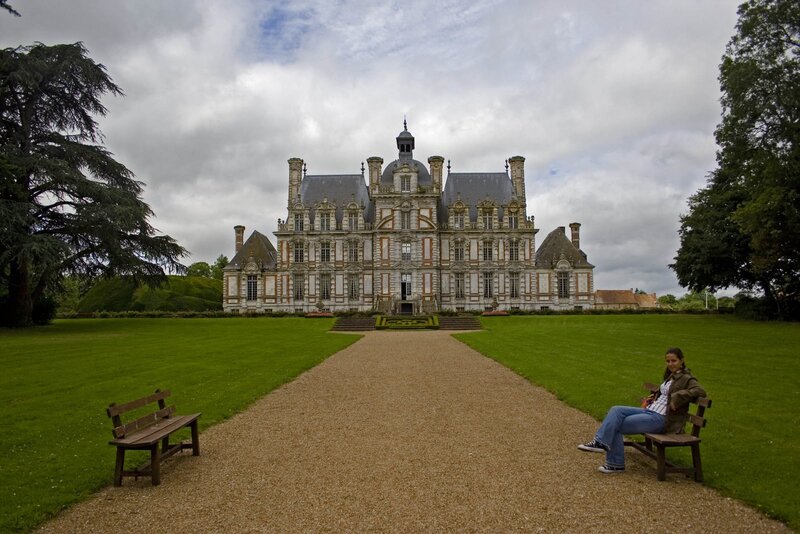 Chateau with woman on bench