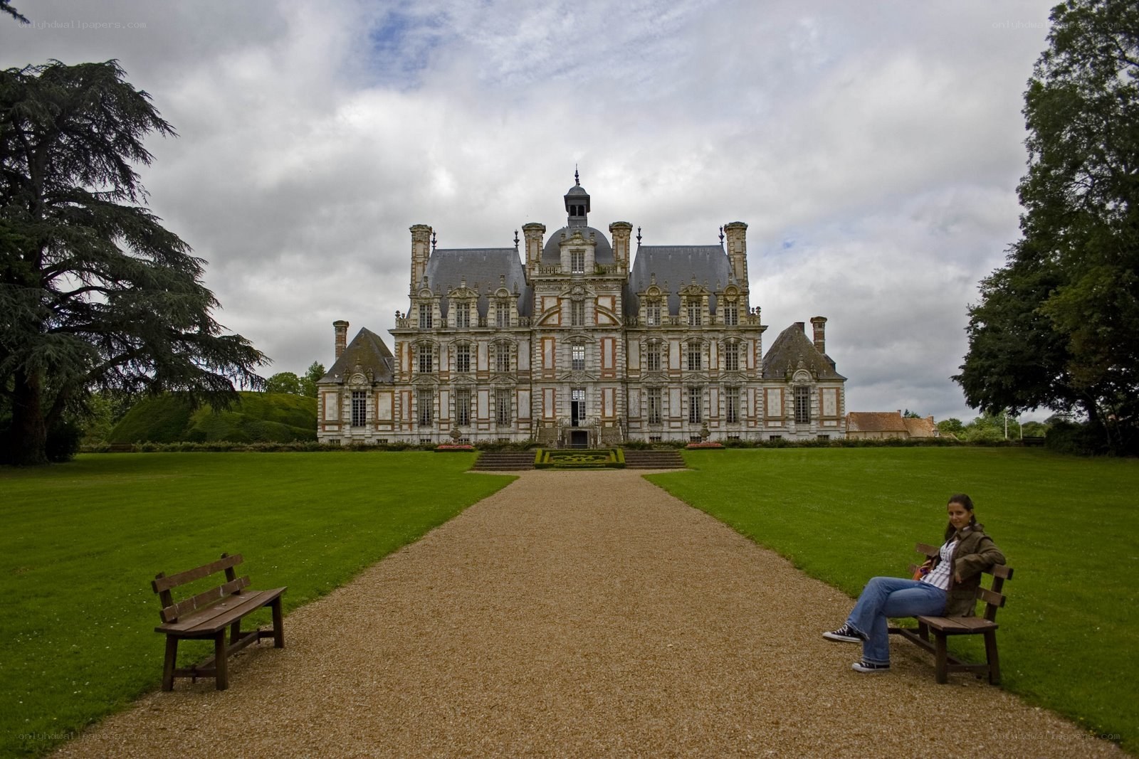 Chateau with woman on bench