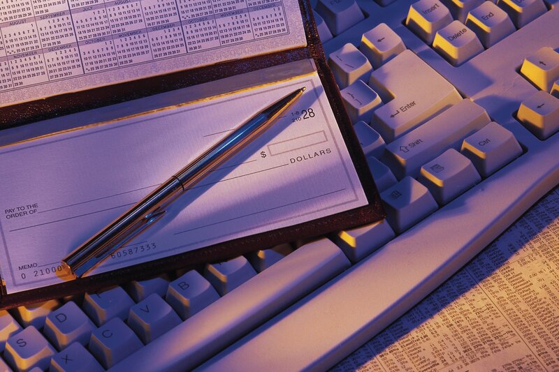 Checkbook on keyboard