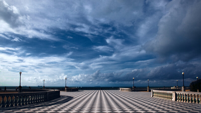 Checkered Pier under Cloudy Sky — Blue