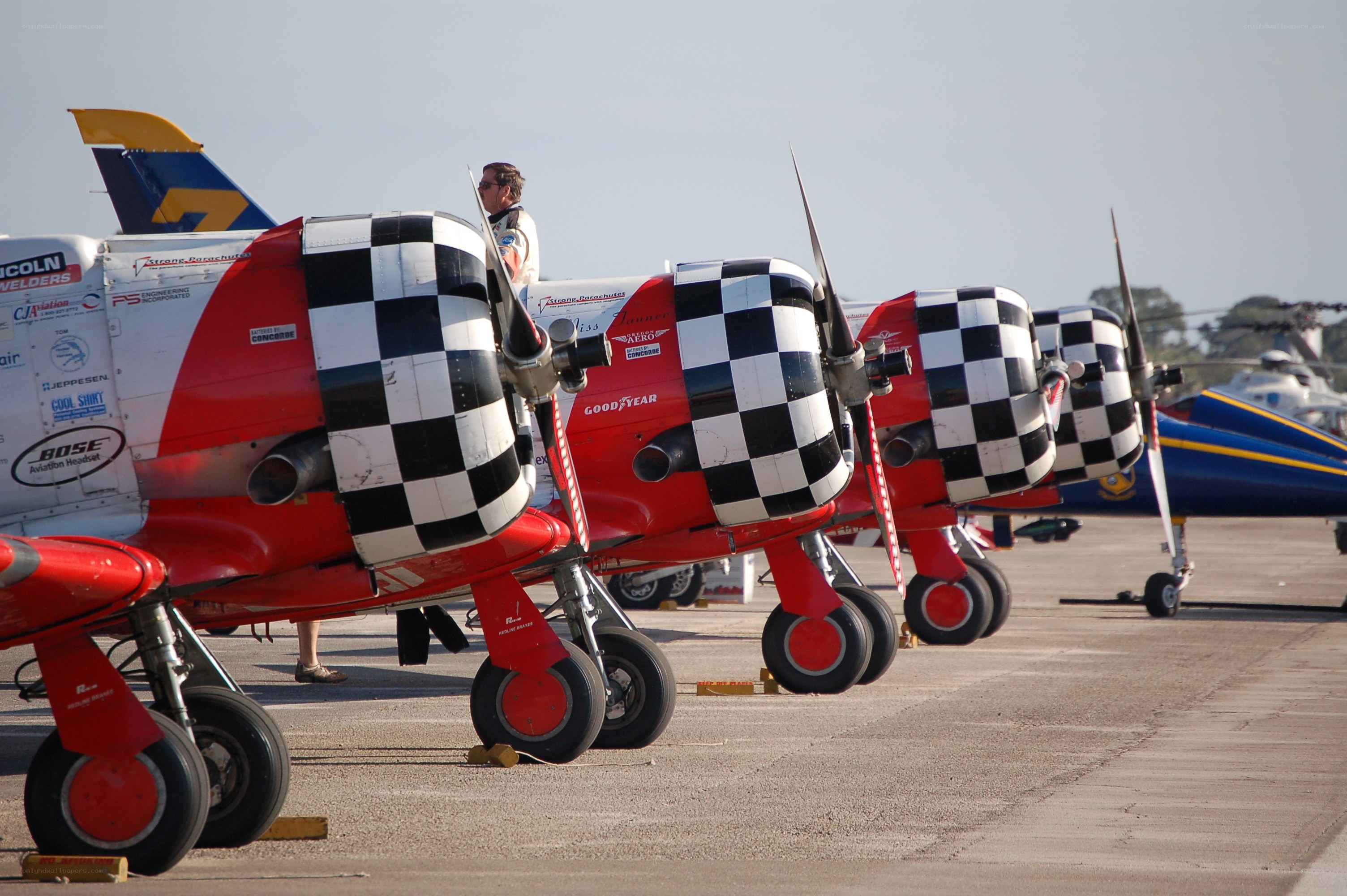 Checkered propeller planes on tarmac