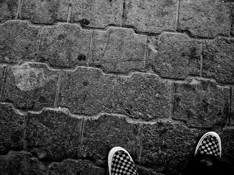 checkered shoes on pavement
